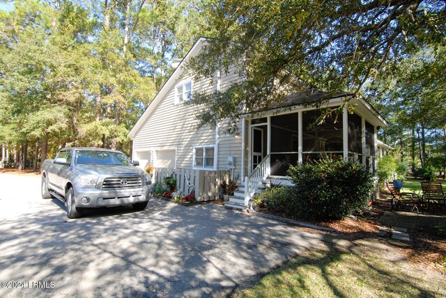 7 Flycatcher Ln, Beaufort, SC 29907 - view of front of house featuring a garage and a sunroom