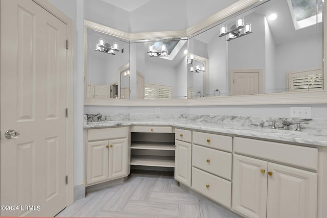 bathroom with parquet floors, lofted ceiling, and vanity