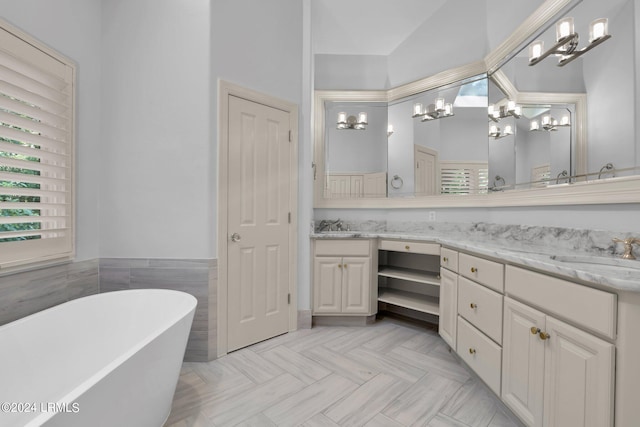 bathroom with vanity, a bathing tub, and tile walls