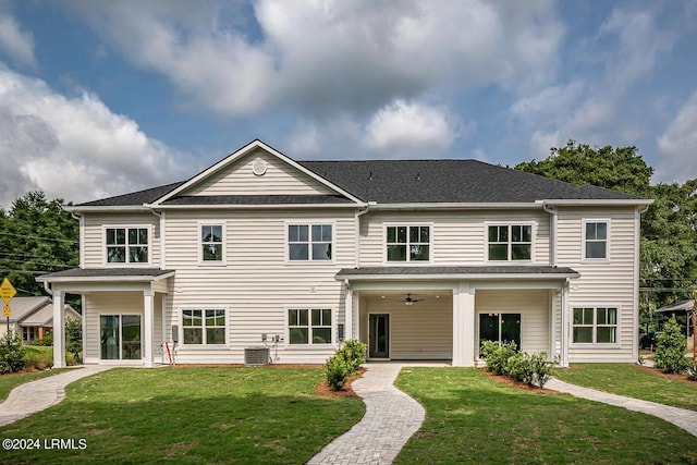 view of front facade with ceiling fan, a front yard, and central air condition unit