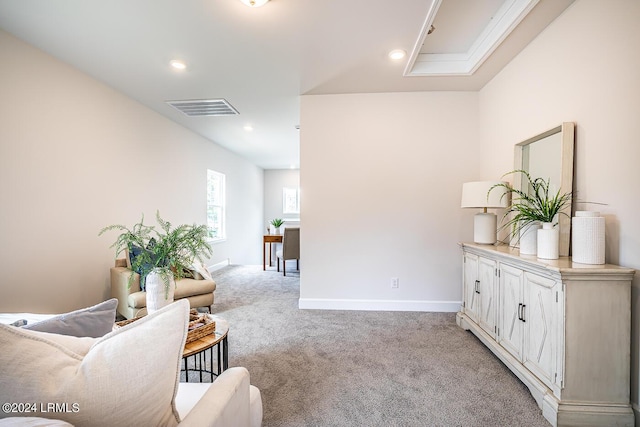 sitting room featuring light colored carpet