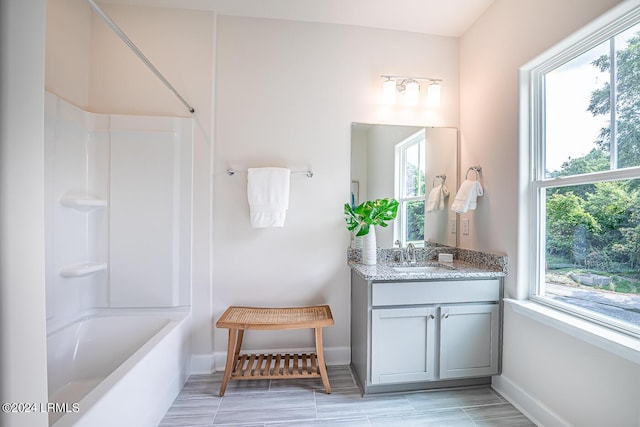 bathroom featuring vanity and bathtub / shower combination