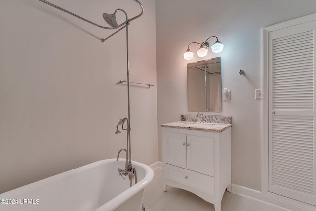 bathroom with vanity and a bath