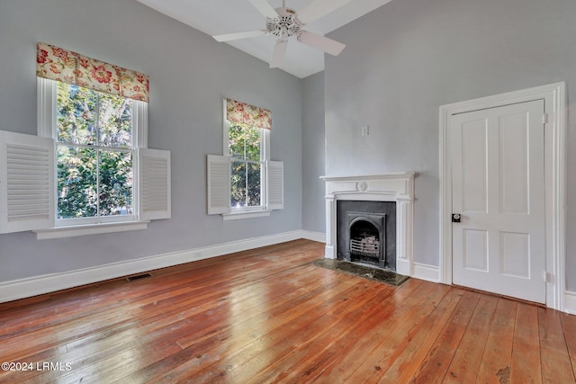 unfurnished living room with ceiling fan and light hardwood / wood-style floors