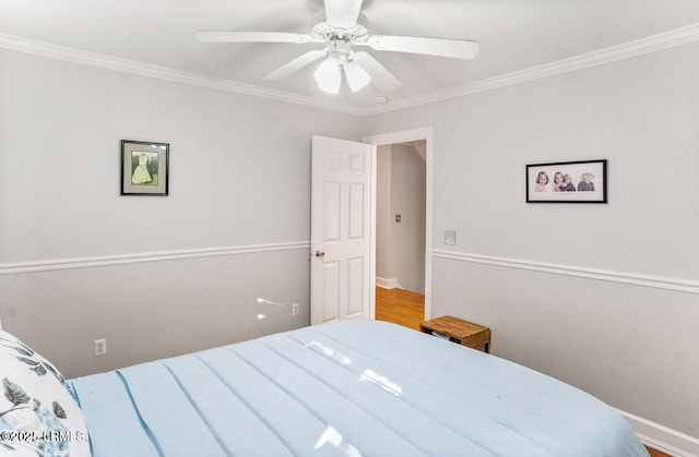 bedroom featuring ornamental molding and a ceiling fan