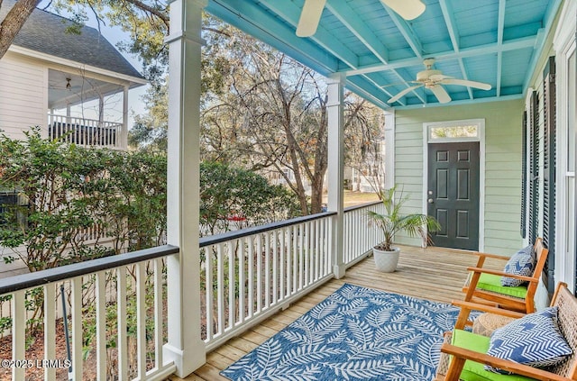 exterior space featuring a sunroom, a porch, and a ceiling fan