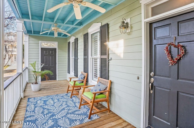 exterior space with ceiling fan and a porch