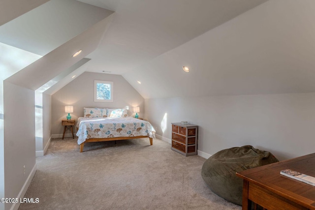 bedroom featuring lofted ceiling, carpet, and baseboards