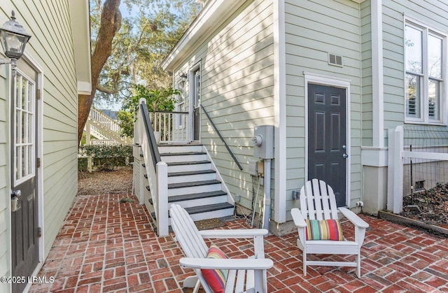 entrance to property with a patio area