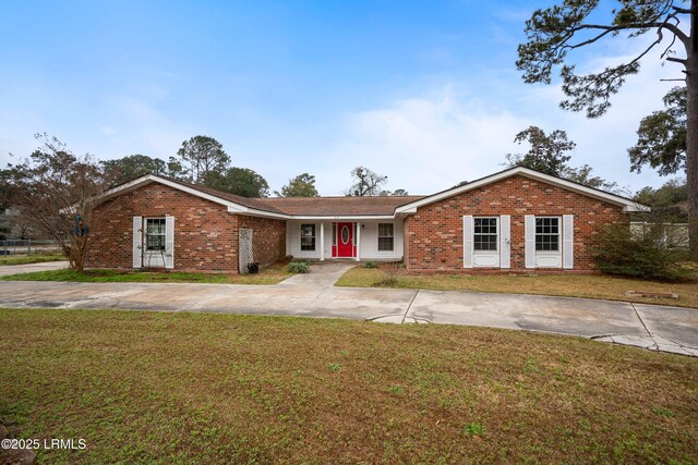 ranch-style house with a front lawn