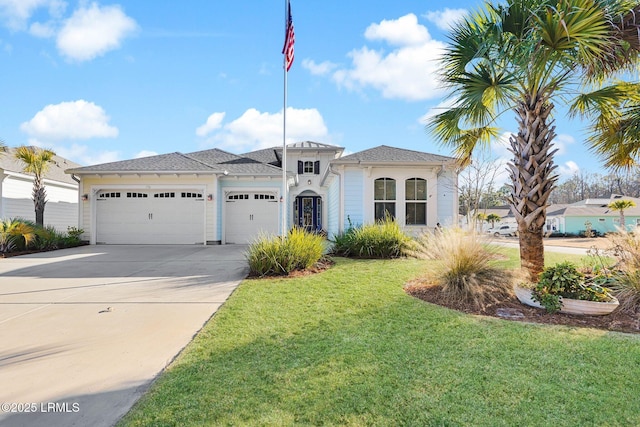 mediterranean / spanish house featuring a garage and a front yard