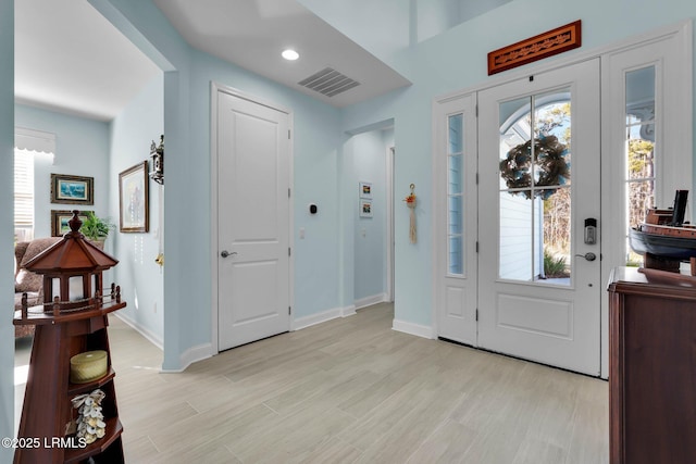 entryway featuring light wood-type flooring and a wealth of natural light