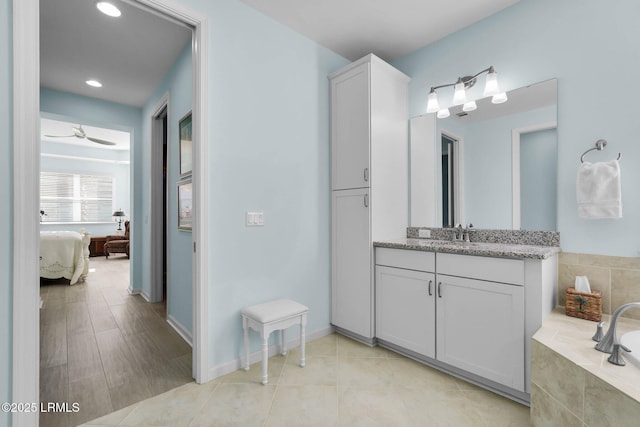 bathroom featuring vanity and ceiling fan