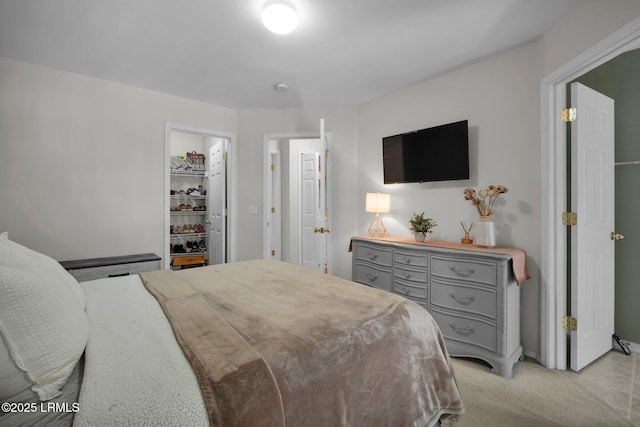 bedroom featuring light carpet