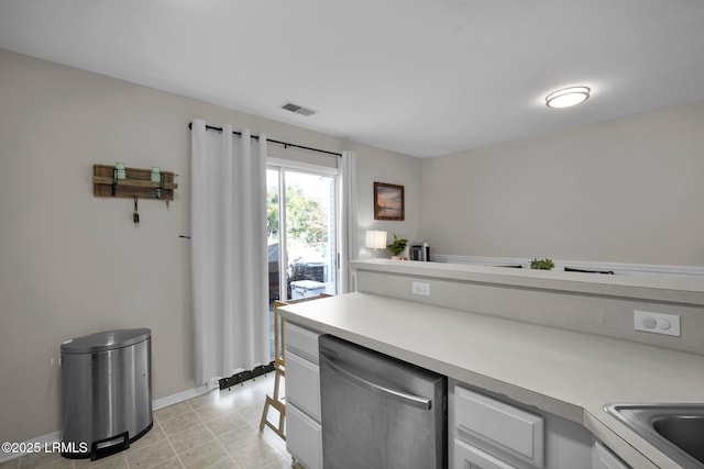 kitchen with white cabinetry and dishwasher