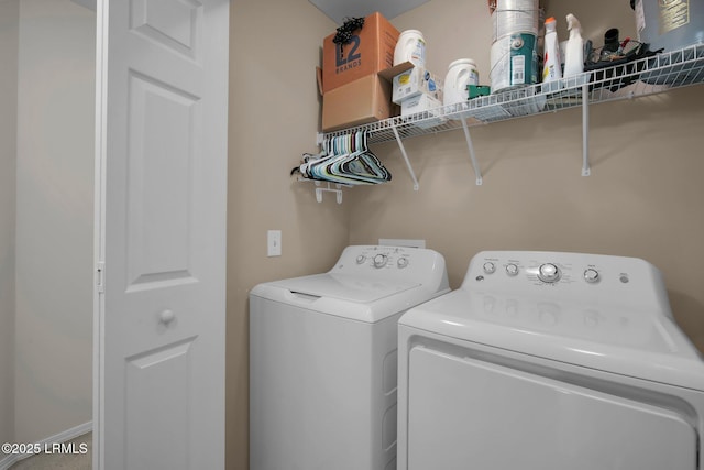 laundry area with independent washer and dryer