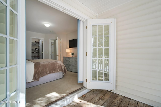 bedroom featuring access to outside and wood-type flooring