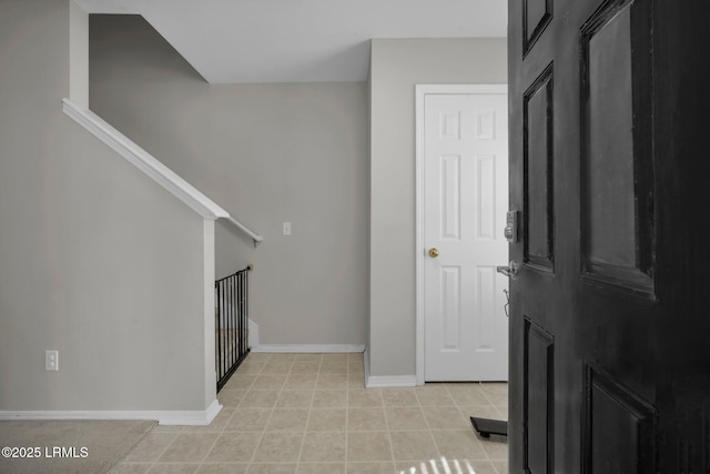 entryway with light tile patterned floors