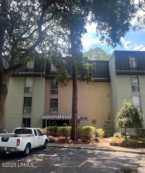 6 Lighthouse Ln Unit 923, Hilton Head Island, SC 29928 - view of property featuring uncovered parking