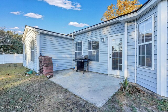 rear view of property featuring a patio