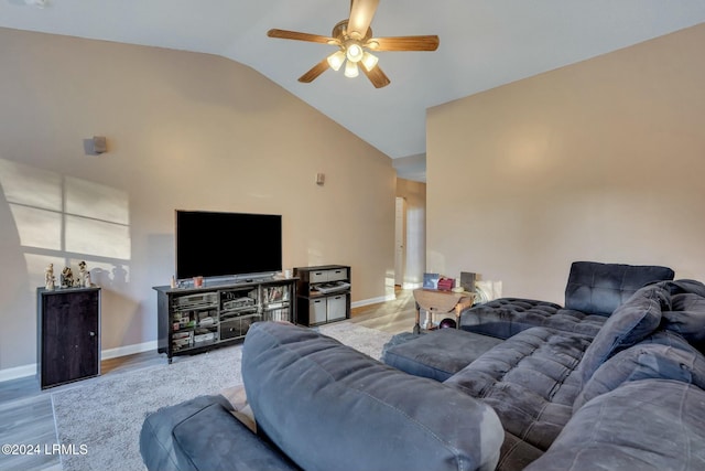 living room with vaulted ceiling, ceiling fan, and light hardwood / wood-style flooring