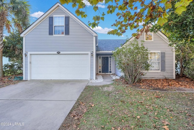 front of property with a garage