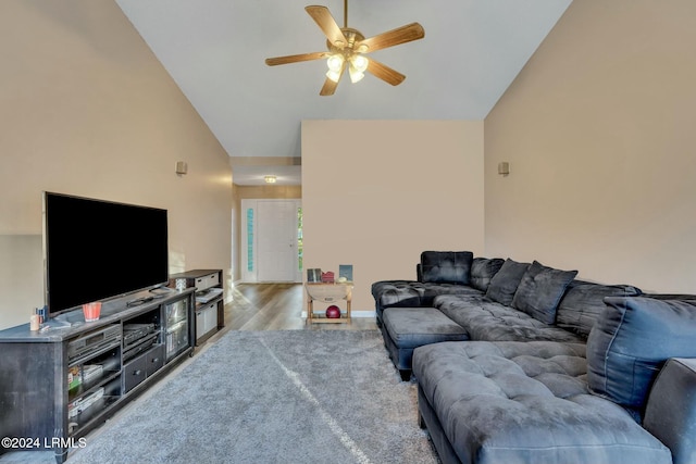 living room with ceiling fan, lofted ceiling, and light hardwood / wood-style floors