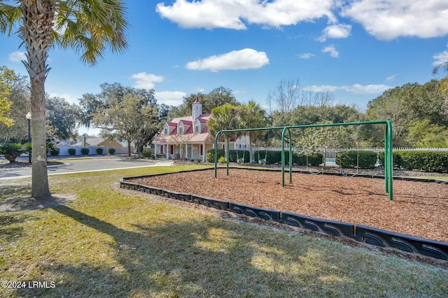 view of jungle gym featuring a lawn