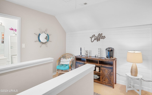 office space featuring lofted ceiling and light carpet