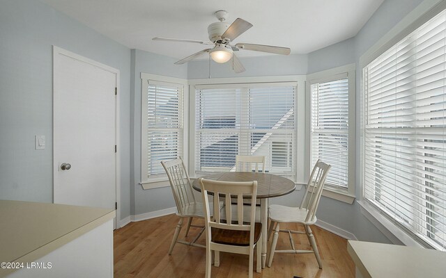 dining room featuring ceiling fan and light hardwood / wood-style flooring