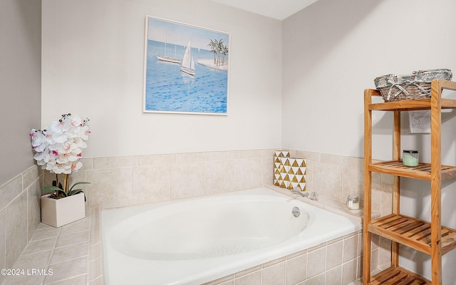 bathroom featuring tile patterned flooring and a relaxing tiled tub