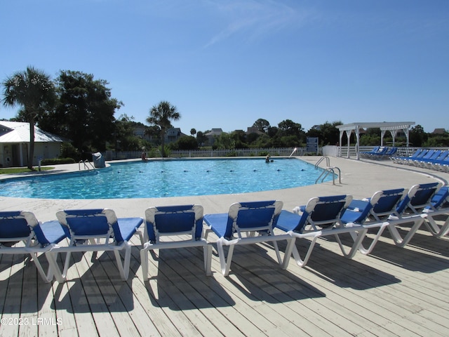 view of swimming pool featuring a patio and a pergola