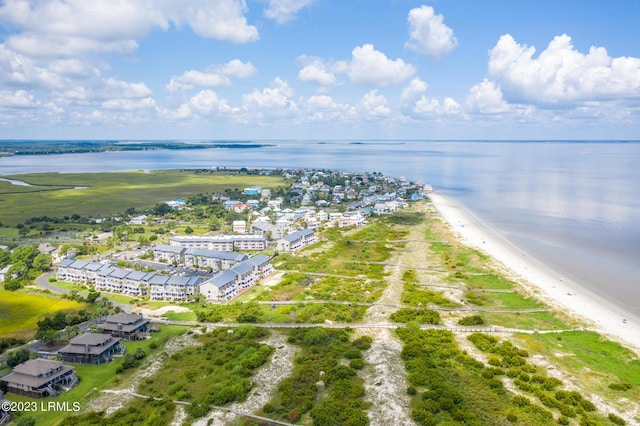 drone / aerial view with a water view and a view of the beach