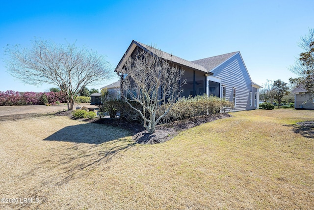 view of home's exterior with a yard