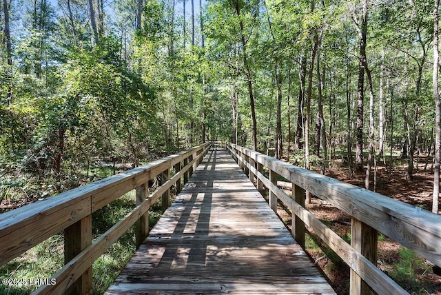 view of dock with a wooded view