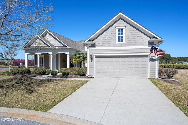 view of front of property with a garage and driveway