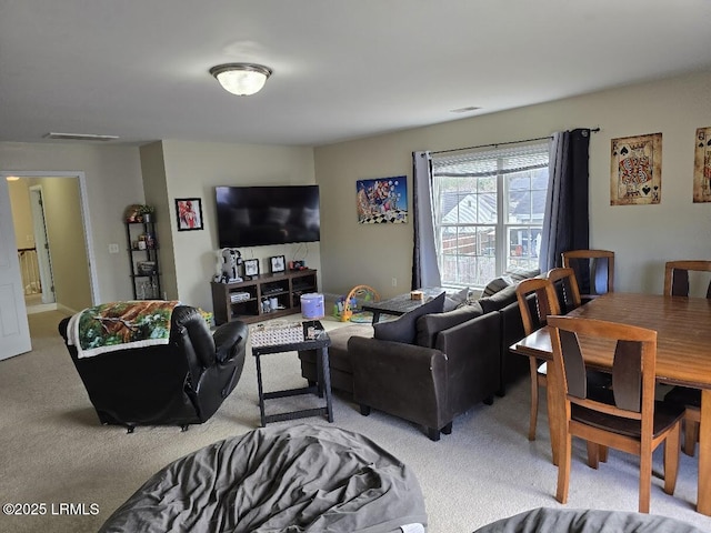 living room featuring light carpet