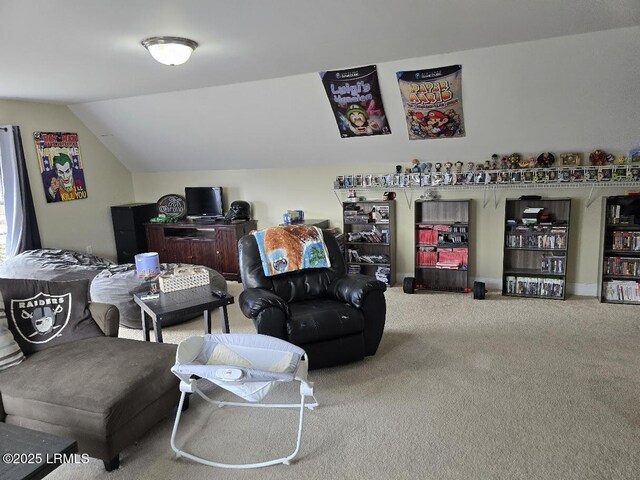 carpeted living room featuring vaulted ceiling