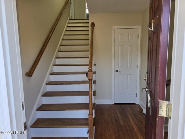 stairway featuring hardwood / wood-style flooring