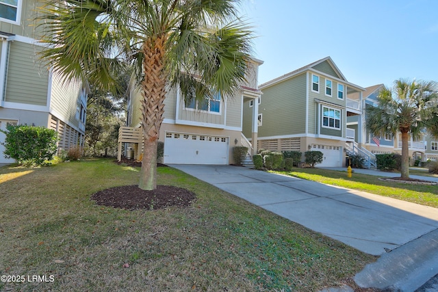 view of front of home with a garage and a front lawn