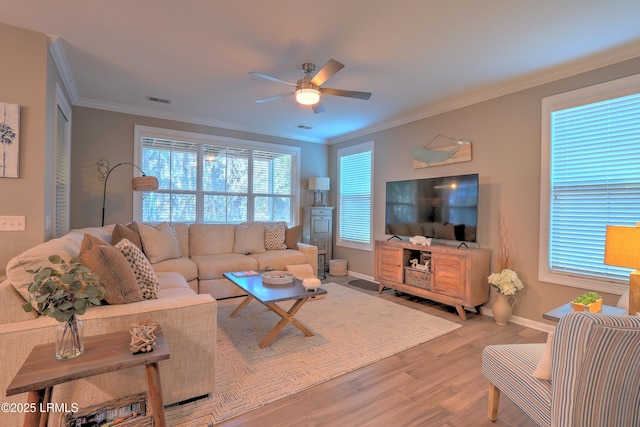 living room featuring crown molding, ceiling fan, and hardwood / wood-style flooring