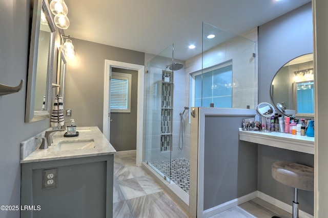 bathroom with an enclosed shower and vanity