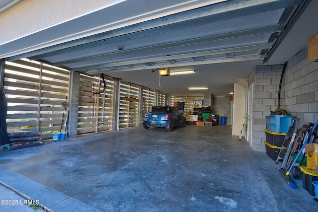 garage featuring a carport and a garage door opener