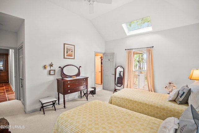 207 Odingsell Ct, Saint Helena Island, SC 29920 - bedroom featuring light colored carpet, a skylight, a closet, high vaulted ceiling, and a ceiling fan