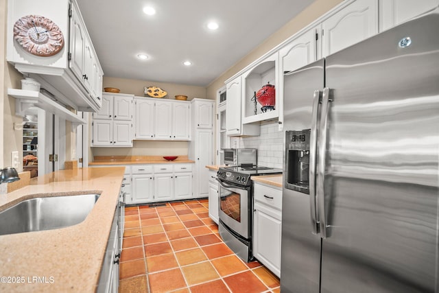 207 Odingsell Ct, Saint Helena Island, SC 29920 - kitchen with appliances with stainless steel finishes, open shelves, white cabinetry, recessed lighting, and a sink