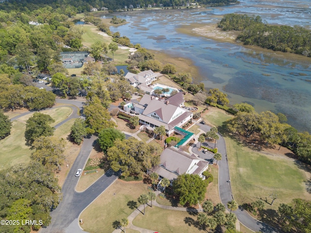 birds eye view of property with a water view and golf course view