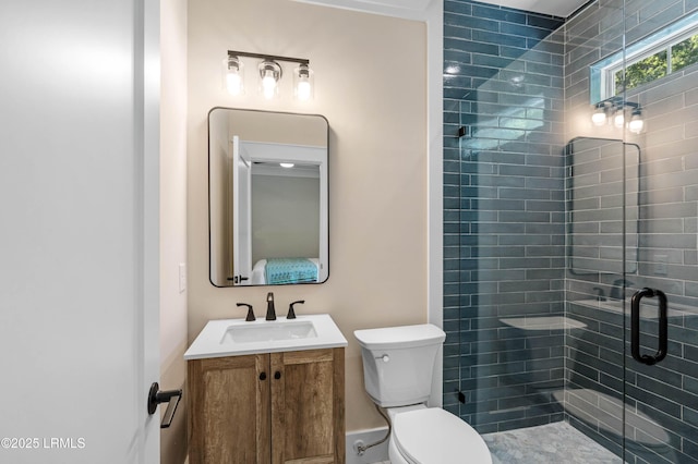 full bath with toilet, a shower stall, and vanity