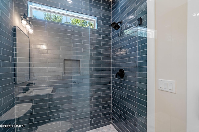 bathroom with tiled shower
