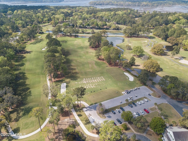 aerial view with view of golf course and a water view