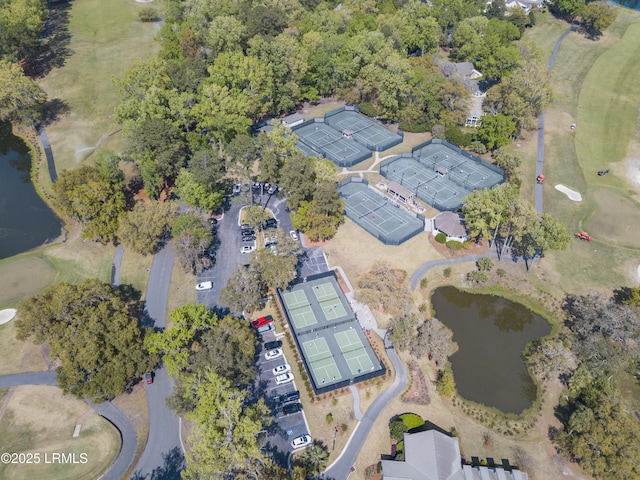 bird's eye view with a water view and golf course view